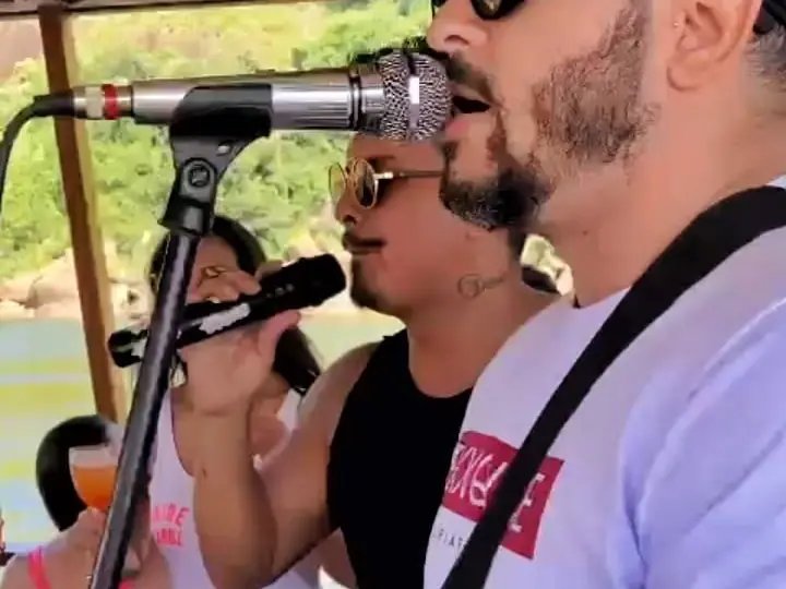 Musicians singing live on a yacht