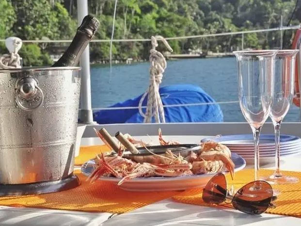 Sparkling wine on ice, glasses and bites on board